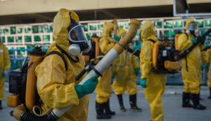 Municipal agents spray anti Zika mosquitos chimical product at the sambadrome in Rio de Janeiro, on january 25, 2016.  Brazil is mobilizing more than 200,000 troops to go "house to house" in the battle against Zika-carrying mosquitoes, blamed for causing horrific birth defects in a major regional health scare, a report said Monday. / AFP / CHRISTOPHE SIMON        (Photo credit should read CHRISTOPHE SIMON/AFP/Getty Images)